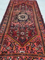 Full view of rug showing geometric design and borders