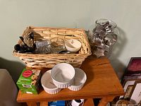 Overall view showing basket, ramekins, parchment cups box and jar of cookie cutters