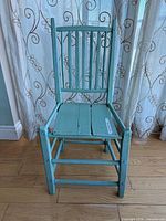 Front view of blue wooden chair