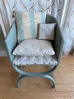 Front angled view of armchair with all three cushions