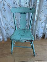 Front view of blue painted fiddle-back chair