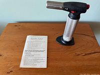 Torch and manual on table