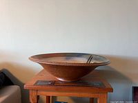 Side view of large ceramic bowl on table