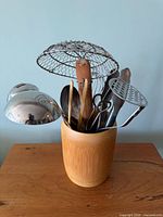 Front view of utensils in wooden holder
