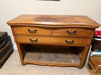 Front view showing entire cabinet with drawers and open shelf