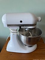 Left side view of mixer with bowl and whip attached