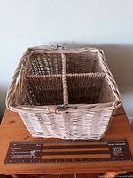 angle view showing overall square wicker basket, side weave and ruler for scale