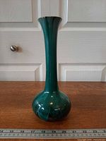 Full side view showing entire vase and scale