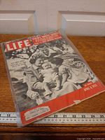 Front cover of Life magazine in plastic sleeve showing Lucille Ball family and date