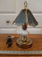 Full view of lamp unlit with cord and ruler for scale