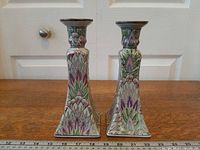 Pair of porcelain candlestick holders front view