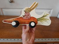 Front view showing full design and hooks with ruler for scale