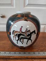 Full view of vase front showing equestrian scene and overall form