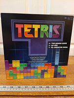 Front of Tetris The Board Game box showing title and age/player info
