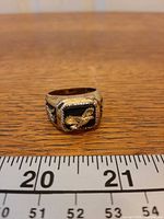 Front view of Bradford Exchange eagle ring with ruler for scale