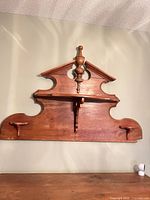 Full view of wall-mounted pine plate shelf showing overall design and finish