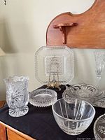 Group of glass and crystal pieces on black cloth
