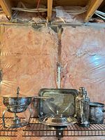 Full group shot showing all silverplate pieces on shelf