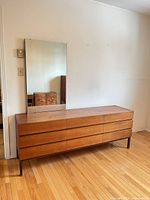 Front view of teak dresser with mirror attached