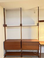 full view of modular shelving system with cabinets and uprights