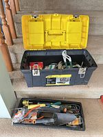 Overall lot with toolbox, open lid and removable tray filled with tools