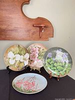 Front view of all four floral plates