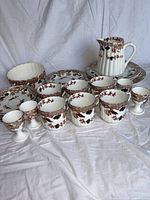 Group shot of complete 26-piece floral china set