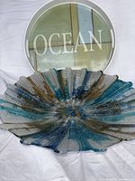 Glass bowl and plastic tray together