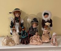 Group shot of all dolls on shelf