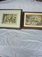 Overview of both framed prints lying side by side