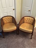 Front view of both matching barrel chairs