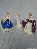 Group shot of all three Royal Doulton lady figurines