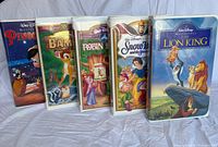 Group shot of all five Disney Masterpiece Collection VHS tapes standing side by side
