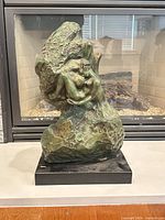 Full view of bronze sculpture on marble base