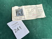 Gemstone in case and certificate overview