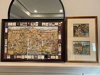 Both framed artworks on mantel