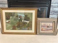 Both framed artworks side by side showing frames and relative sizes