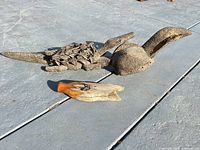Side view of duck sculpture showing head and neck
