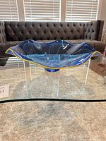 angled side view showing shape, color, yellow rim