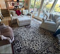 Full view of Persian style area rug beneath furniture
