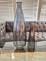 Both vases side by side on glass table