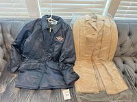 Front view of both coats on couch
