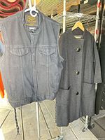 Front view of both garments hanging—vest and coat