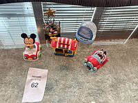 All five Disney Mickey items on glass table