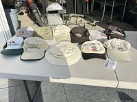All 11 hats laid out on table