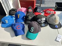 Group shot of all 12 caps on table