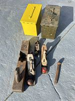 Lot overview with hand planes, two ammo boxes and metal spike