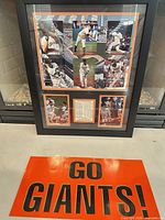 Full view of framed collage and orange GO GIANTS sign
