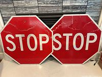 Front view of both stop signs side by side