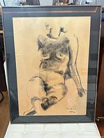 Full view of framed charcoal figure drawing